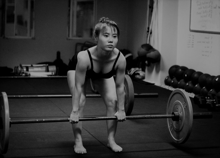 Woman Barbell Deadlifting